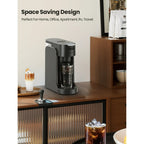 Compact single serve coffee maker brewing a fresh cup