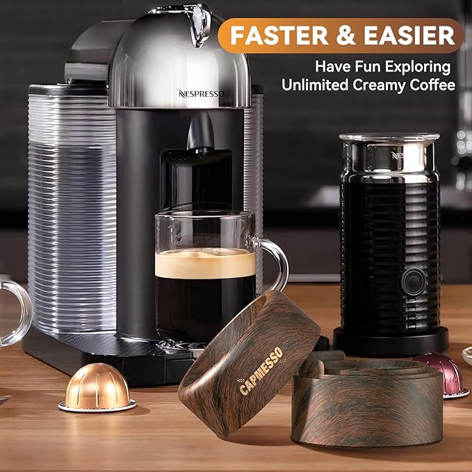 A coffee machine brews espresso into a glass cup, surrounded by the Reusable Vertuo Pod Refill Kit from CAPMESSO, which includes Faster Seal Reusable Nespresso Vertuo Pods and vibrant refill accessories. Next to it is a black milk frother. A wooden box branded with "CAPMESSO" is nearby. Text at the top reads, "Faster & Easier. Have Fun Exploring Unlimited Creamy Coffee.