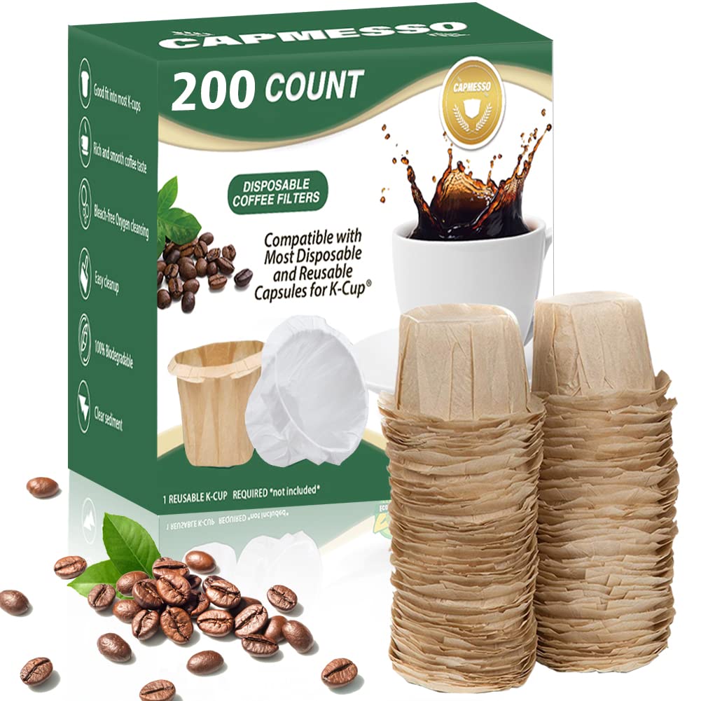 A 200-count box of CAPMESSO disposable coffee paper filters showcases a stack of biodegradable filters, surrounded by scattered coffee beans. The packaging emphasizes their compatibility with Keurig Brewers' single-serve, reusable K-Cup capsules for both 1.0 and 2.0 models, promoting an eco-friendly and efficient brewing experience.